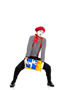 mime holding heavy gift boxes isolated on white