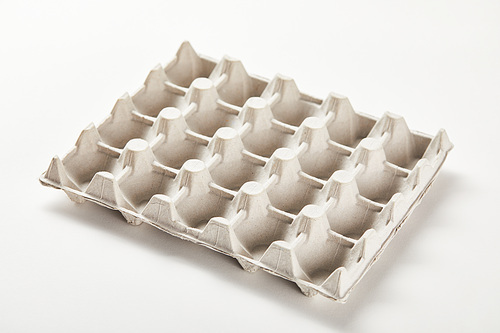 empty egg carton box on white surface
