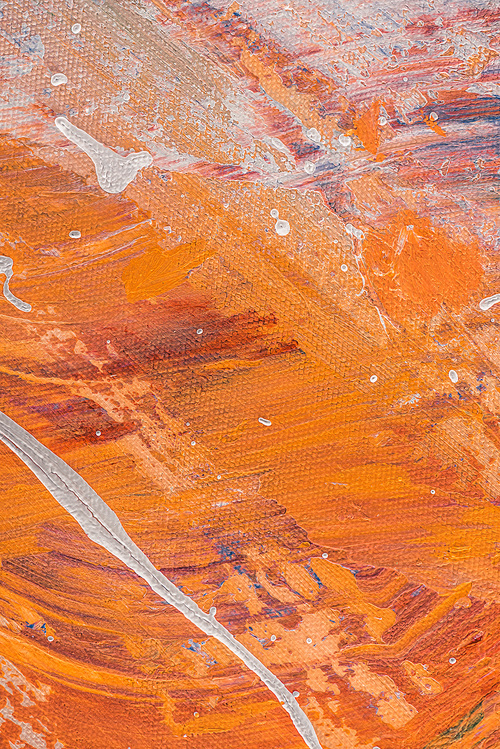 abstract orange texture with oil paint splatters
