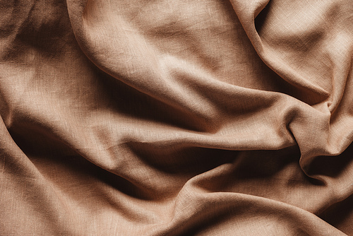 top view of beige linen tablecloth texture