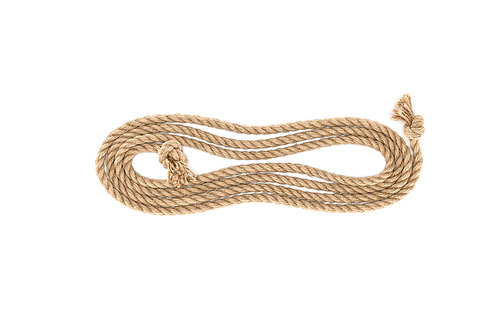 top view of arranged brown marine rope with knots isolated on white