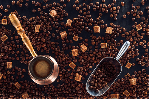 flat lay with roasted coffee beans| coffee brewer and metal scoop