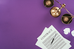 top view of business contract with pen and justice scales on purple surface