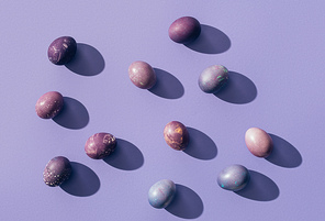 purple background with purple painted eggs for Easter