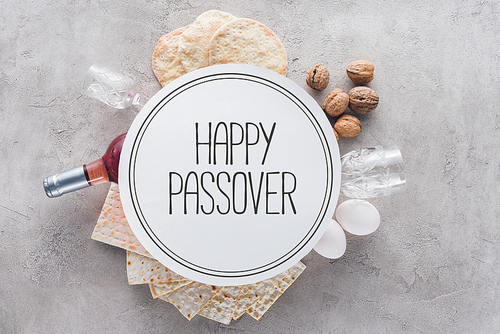 top view of matza and plate with happy passover greeting| jewish Passover holiday concept