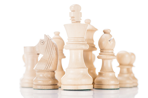 white wooden chess king with knight and bishop on sides on white