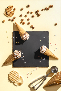 top view of three ice cream on yellow