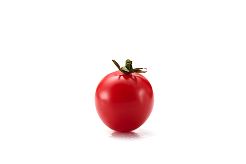 close up view of ripe cherry tomato isolated on white