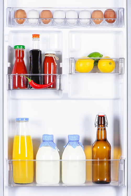 eggs, souses, milk and juice in fridge