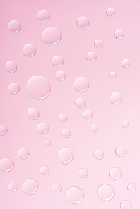 abstract background with transparent water drops on pink