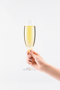 cropped shot of woman holding glass of champagne in hand isolated on white