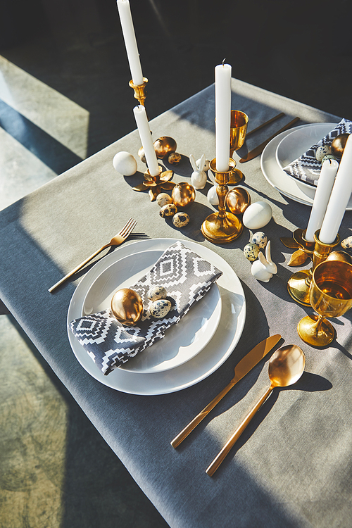 high angle view of beautiful decorated easter table with sunlight