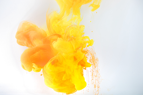 artistic background with flowing yellow and orange paint, isolated on grey