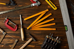 top view of different tools on brown wooden table