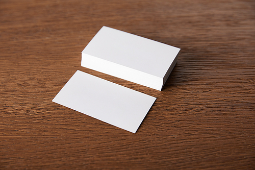 selective focus of stack of empty business cards at wooden table