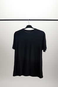 one black shirt on hanger isolated on white