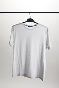 one white shirt on hanger isolated on white