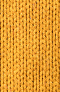 texture of warm knitted yellow sweater