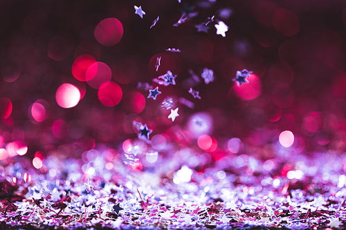 christmas texture with falling pink and silver shiny confetti stars