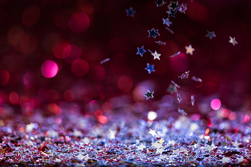 christmas background with falling pink and silver shiny confetti stars