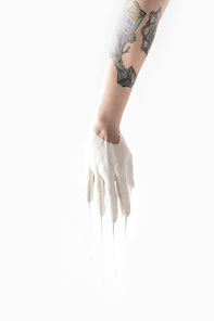 cropped image of woman in white paint and with tattoos isolated on white