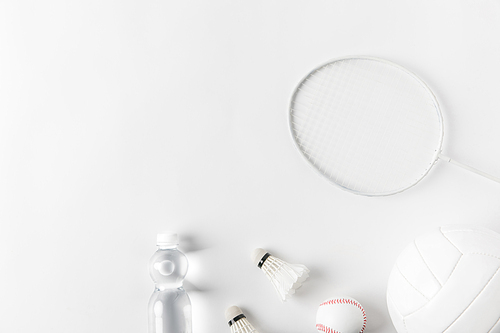 variation of sports equipment on white surface