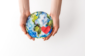 cropped shot of woman holding handmade globe with read heart in hands isolated on grey, environment protection concept
