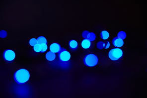 abstract dark texture with blue bokeh