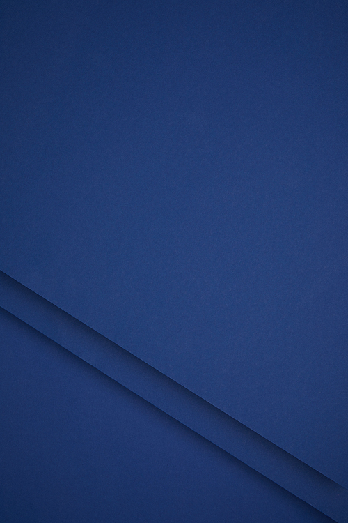 dark blue abstract background from colored paper