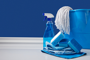 blue rags, bucket and spray for spring cleaning