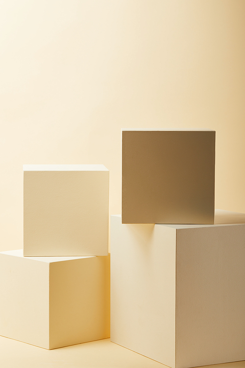 composition of beige cubes in various sizes