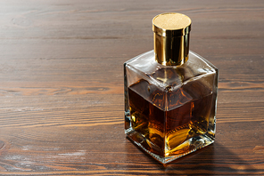 bottle of luxury alcohol on brown wooden table