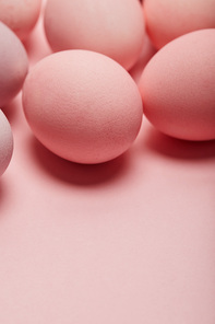 easter eggs on pink background with copy space