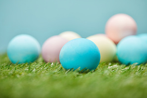 selective focus of easter chicken eggs on grass