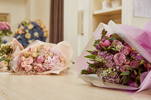 Selective focus of bouquet of tulips, peonies and lilac