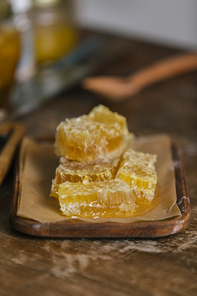 close-up shot of sliced honeycomb on rustic wooden table