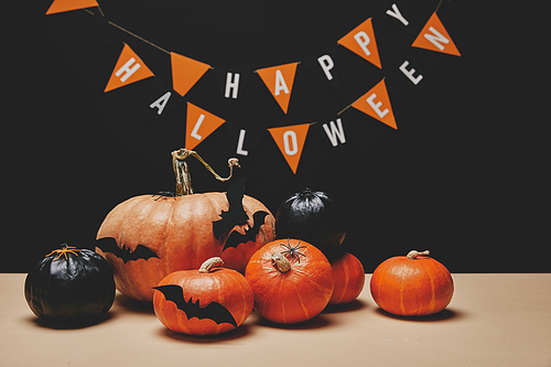 pumpkins| paper bats and paper garland with words happy halloween