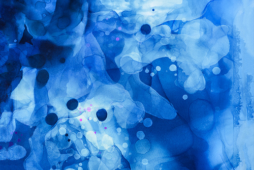 dark blue splashes of alcohol ink as abstract background