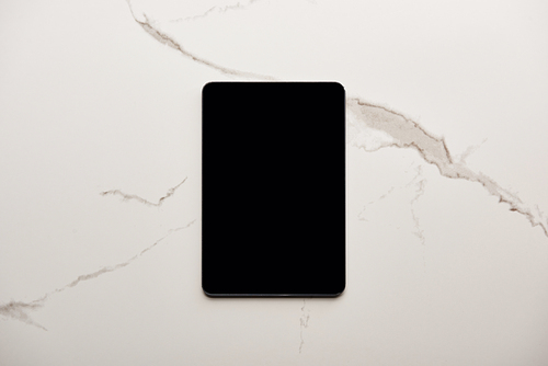 top view of tablet on white marble surface