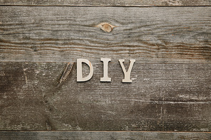 Top view of wooden diy sign on wooden background