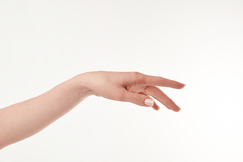 Partial view of well-cared woman hand on white surface