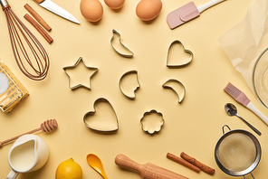 top view of bakery ingredients and cooking utensils around dough molds