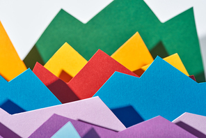 selective focus of multicolored paper graphs on white background