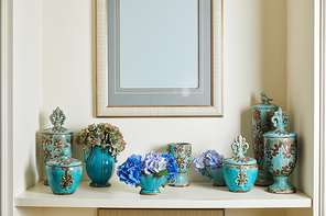 picture frame and turquoise set with flowers on surface with copy space