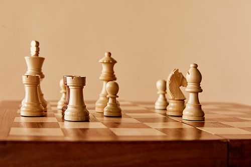 chess on chess board and beige background