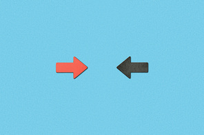 top view of opposite horizontal red and black arrows on blue background