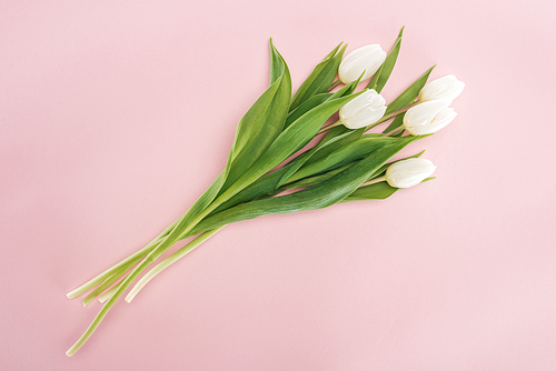 top view of spring bouquet with white tulips isolated on pink