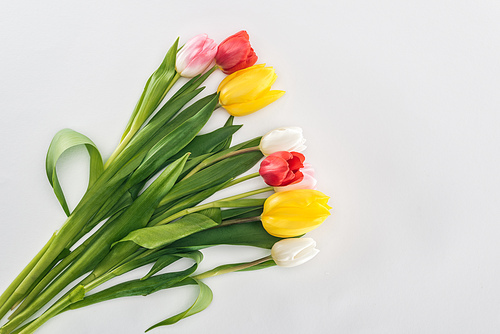 top view of bouquet with colorful tulip flowers isolated on grey