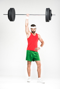 strong sportsman in retro sportswear training with barbell, isolated on white
