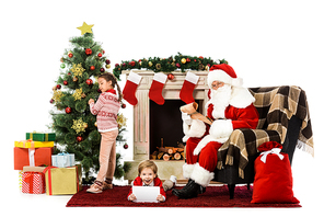 happy kids and santa  while spending time together isolated on white